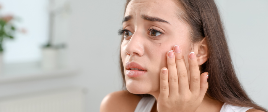girl stressing that her lashes are falling out