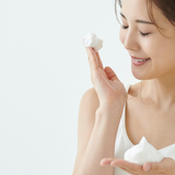 Girl applying Prolong Lash Foaming Cleanser to her eyes
