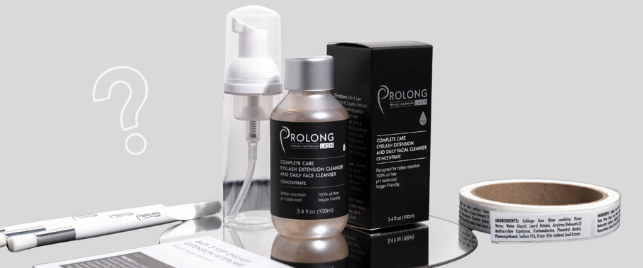Prolong Lash cleanser concentrate with foaming bottle pump, retail packaging, and cleansing brush displayed on a reflective surface.
