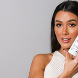 Girl holding a prolong lash foaming pump by her face