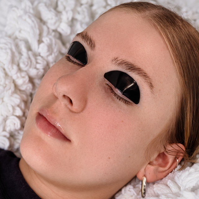 Women with eyes closed with Flutterstop jelly pads on eyelids